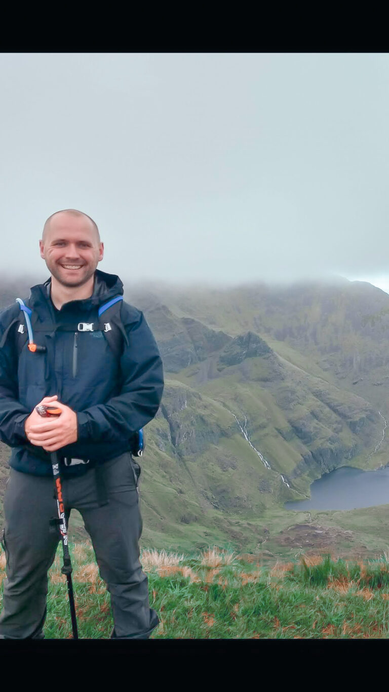 Image of Alfie Golden with a cliff in the background